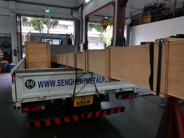 Long metal bar stock secured on the Seng Huat Metalplex delivery lorry Long metal bar stock secured on the Seng Huat Metalplex delivery lorry